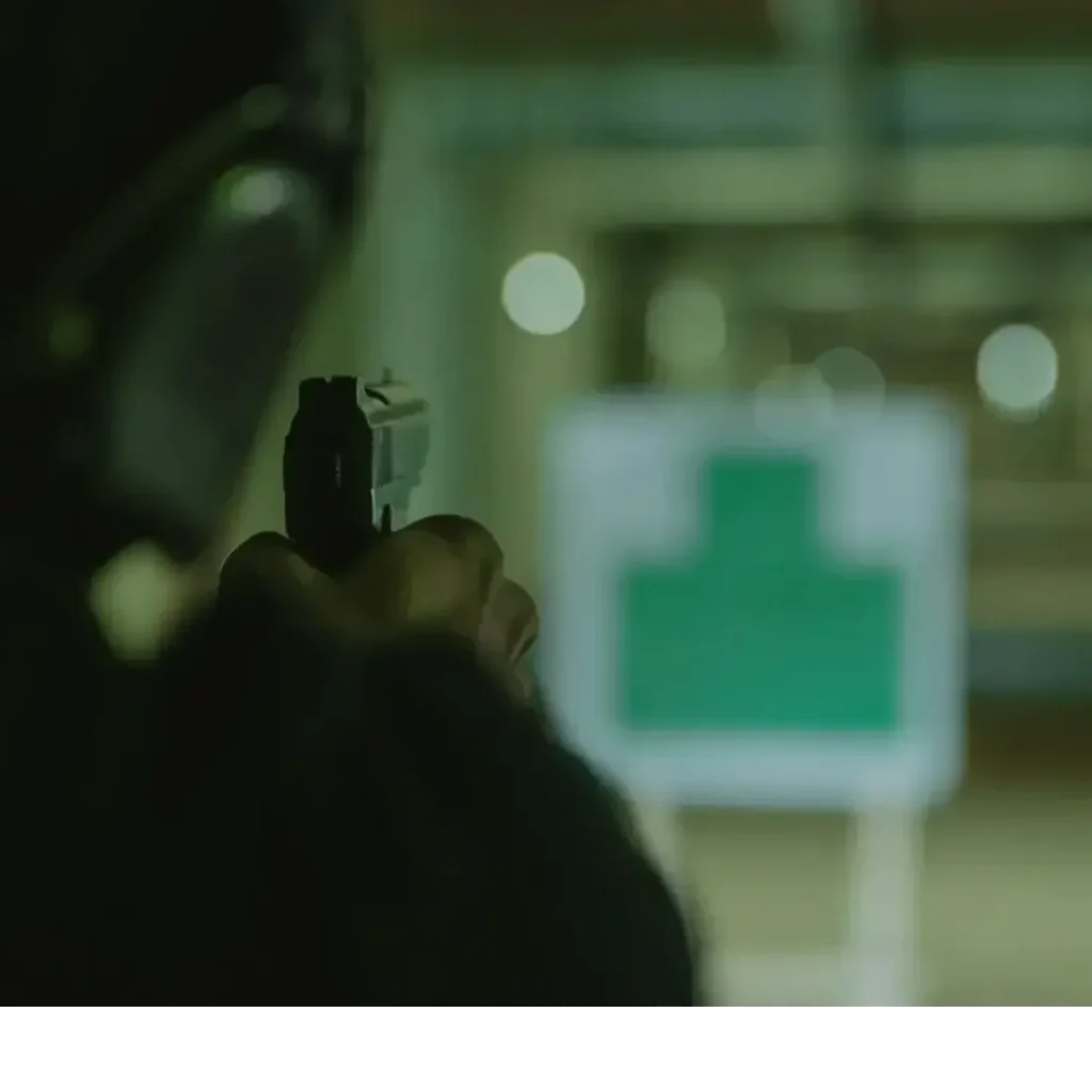 Shooter Aiming on Target – Example of Tritium Night Sight Visibility